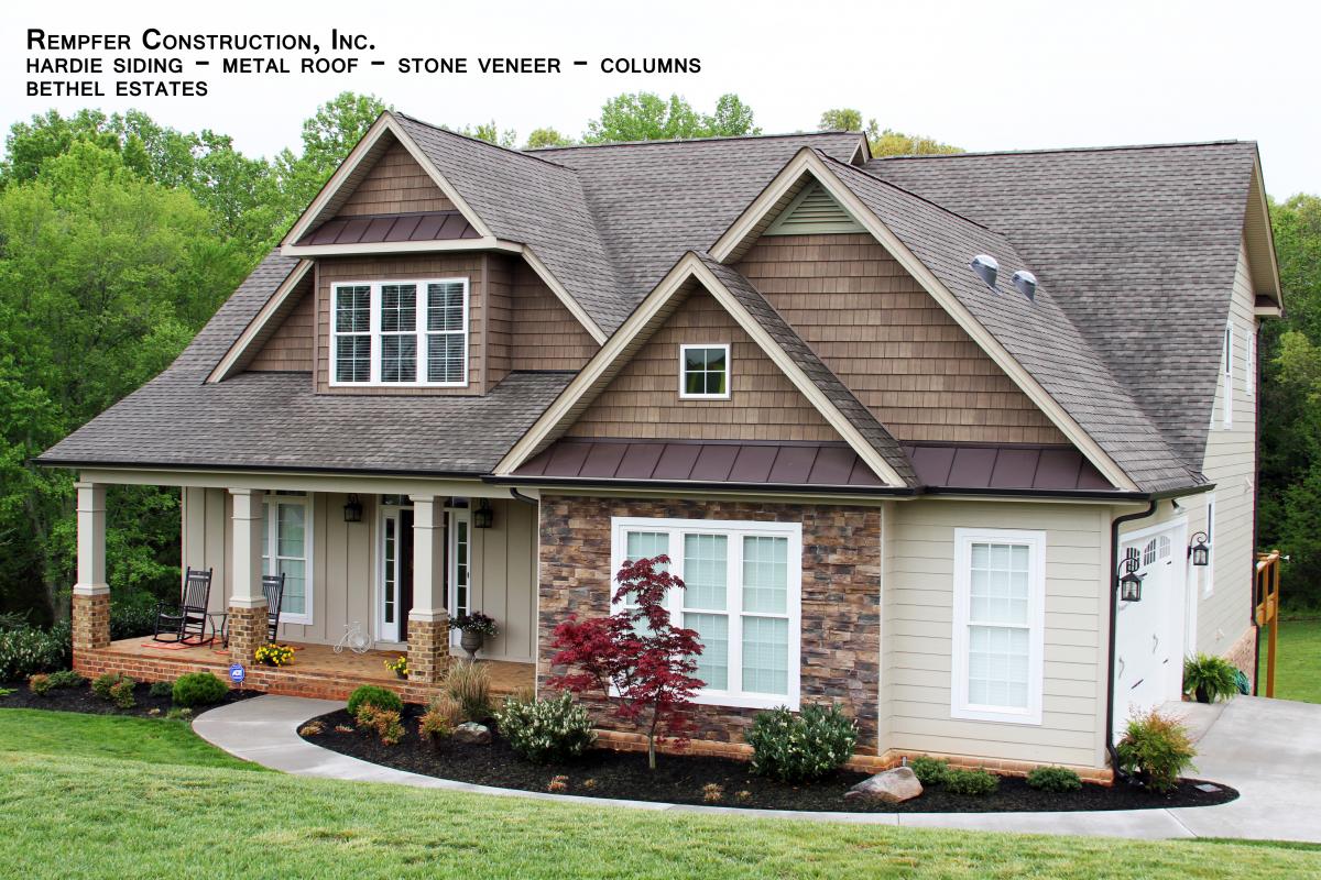 A home with newly installed shake and stone veneer